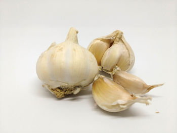 Close-up of pumpkins against white background