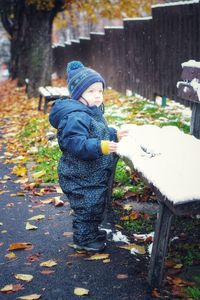 Boy standing in park during winter