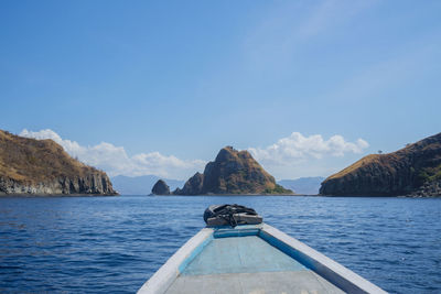 Boat on sea against blue sky