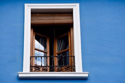 Low angle view of window on the wall