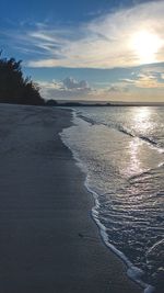 Scenic view of beach against sky during sunset