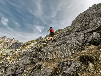 Rear view of man hiking on mountain