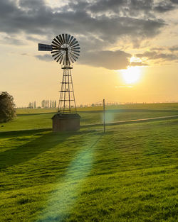 Scenic view of field against sky during sunset