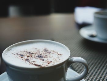 Close-up of cappuccino on table