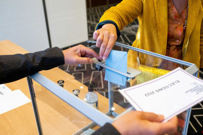 Cropped hand of man working at table