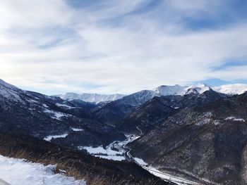 Scenic view of snowcapped mountains against sky