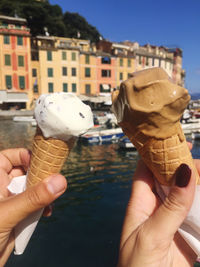 Close-up of hand holding ice cream