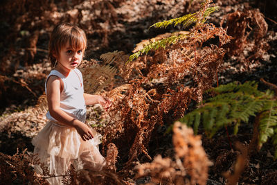 Full length of girl standing on land