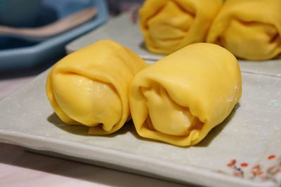 Close-up of yellow slices on table