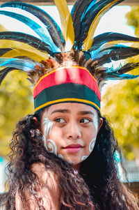 Close-up of smiling woman wearing costume