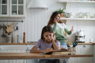 Mother and daughter at home