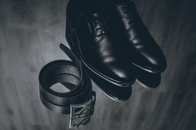 High angle view of shoes and belt on table