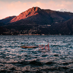 It's too cold to swim, but the jumping board is waiting for the heat. mountains in the evening sun.