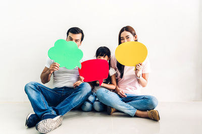 People sitting against white background