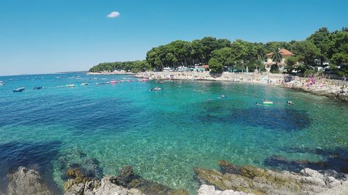 Scenic view of sea against clear blue sky