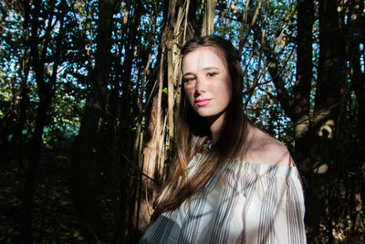 Attractive young woman in forest