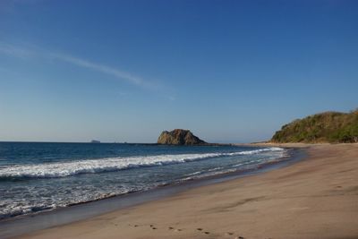 Scenic view of beach against clear sky