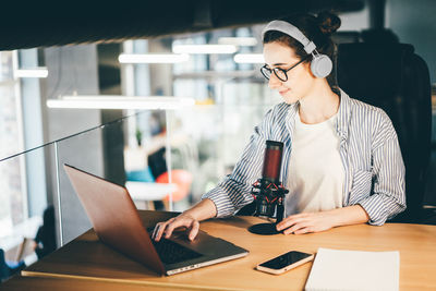 Businesswoman working at table