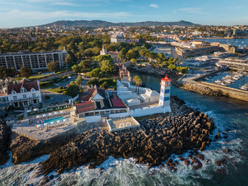 Aerial view of santa marta lighthouse and cascais marina with cascais cityscape