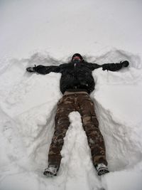 Person standing on snow covered field