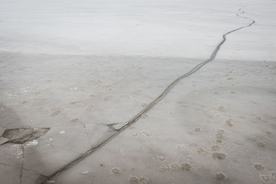 High angle view of wet sand