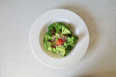 Directly above shot of fried broccoli in plate on table