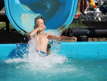 Boy playing in swimming pool