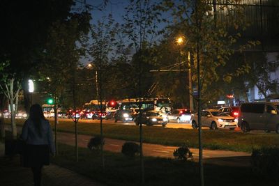 View of vehicles on road at night