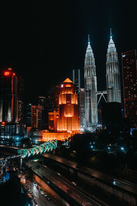 Illuminated buildings in city at night