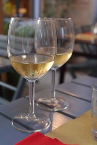 Close-up of wine in glasses on table