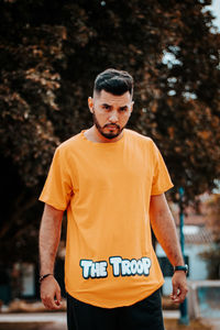 Portrait of young man standing outdoors