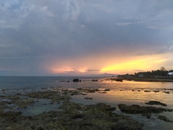 Scenic view of sea against dramatic sky