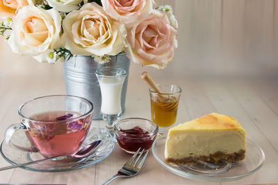 Close-up of roses in vase on table