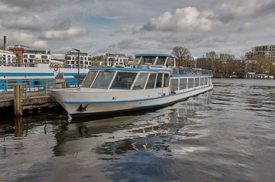 Boats in sea against sky