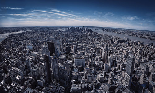 High angle view of city against cloudy sky