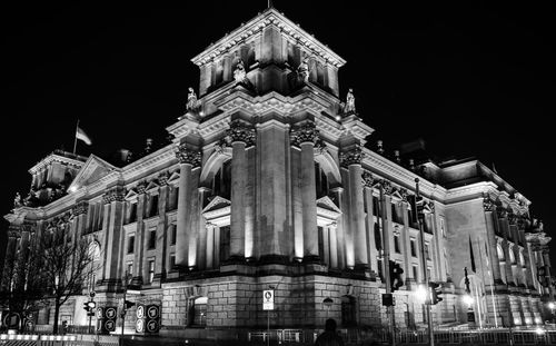 Low angle view of historical building at night