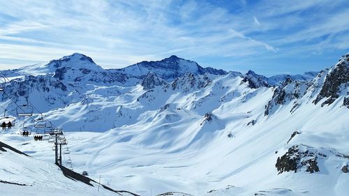 Ski resort against cloudy sky