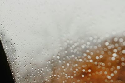 Full frame shot of wet glass window