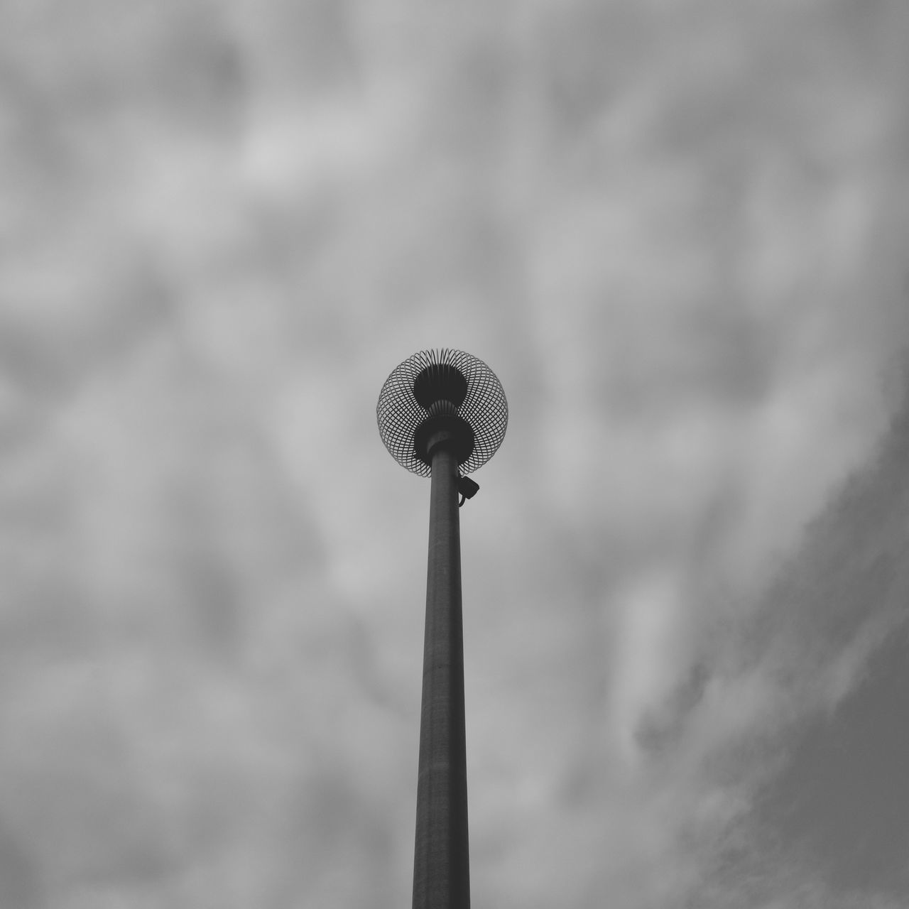 black and white, cloud, sky, monochrome, monochrome photography, street light, low angle view, no people, white, communication, nature, technology, black, outdoors, day, architecture, broadcasting, lighting, overcast, street, wind, built structure, light