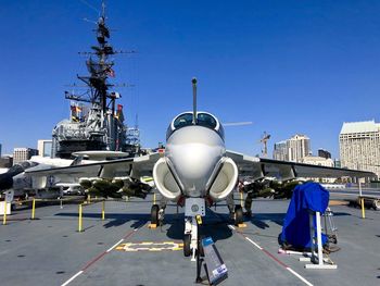 View of airport runway against clear blue sky