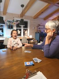 High angle view of woman using digital tablet at home