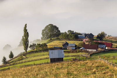 House on field against sky