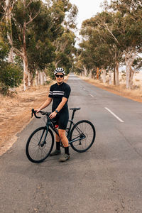 Man riding bicycle on road