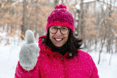 Portrait of a smiling woman in snow