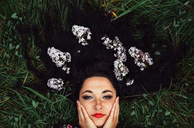 Portrait of woman with flower plants