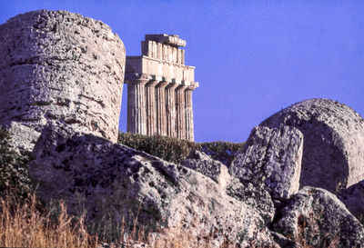 Low angle view of historical building against blue sky