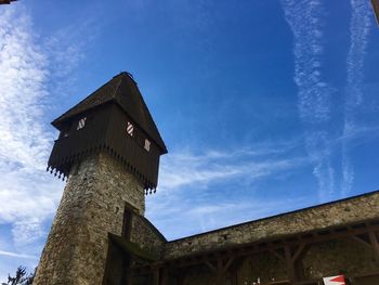 Low angle view of old building against blue sky