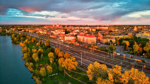 High angle view of river amidst trees against sky