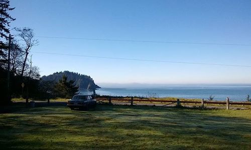 View of calm sea against clear blue sky