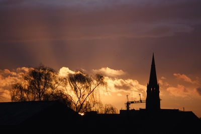 Silhouette of trees against sky at sunset